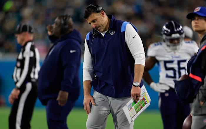 Tennessee Titans head coach Mike Vrabel listens on his headset during the second quarter of an NFL football regular season matchup AFC South division title game Saturday, Jan. 7, 2023 at TIAA Bank Field in Jacksonville.